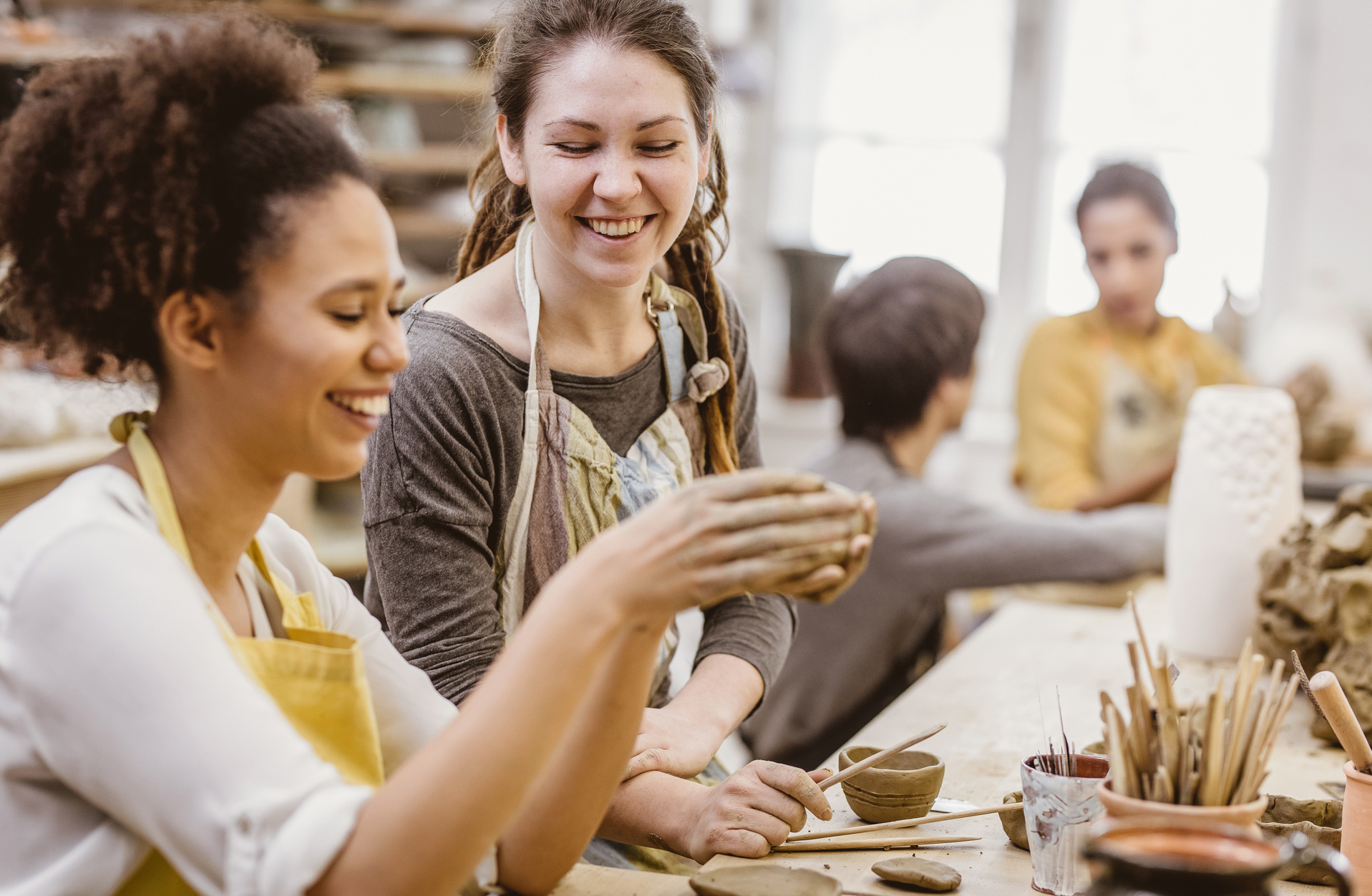 Small Group of People Doing Pottery in an Art Studio